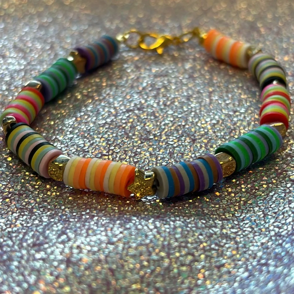 Girls multi colored clay beads bracelet with gold star and block charms. - Picture 4 of 6